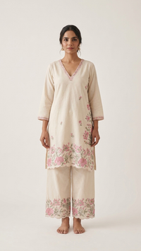 Cream base fabric with pink and green floral embroidery