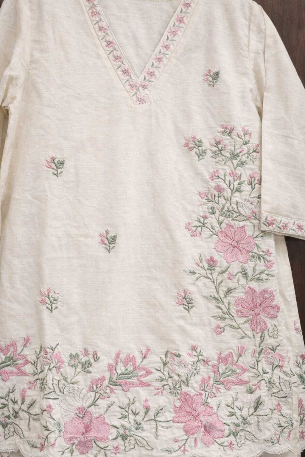 Cream base fabric with pink and green floral embroidery